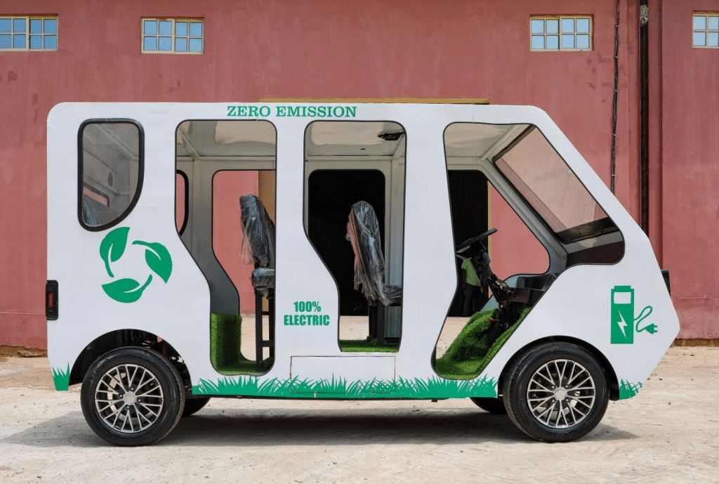 A "zero emission" vehicle with fake grass floor carpeting outside the warehouse of Phoenix Renewables